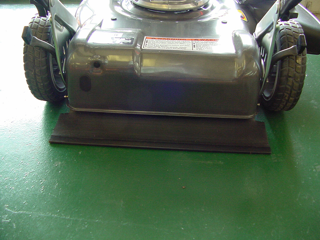 foot shield on lawnmower