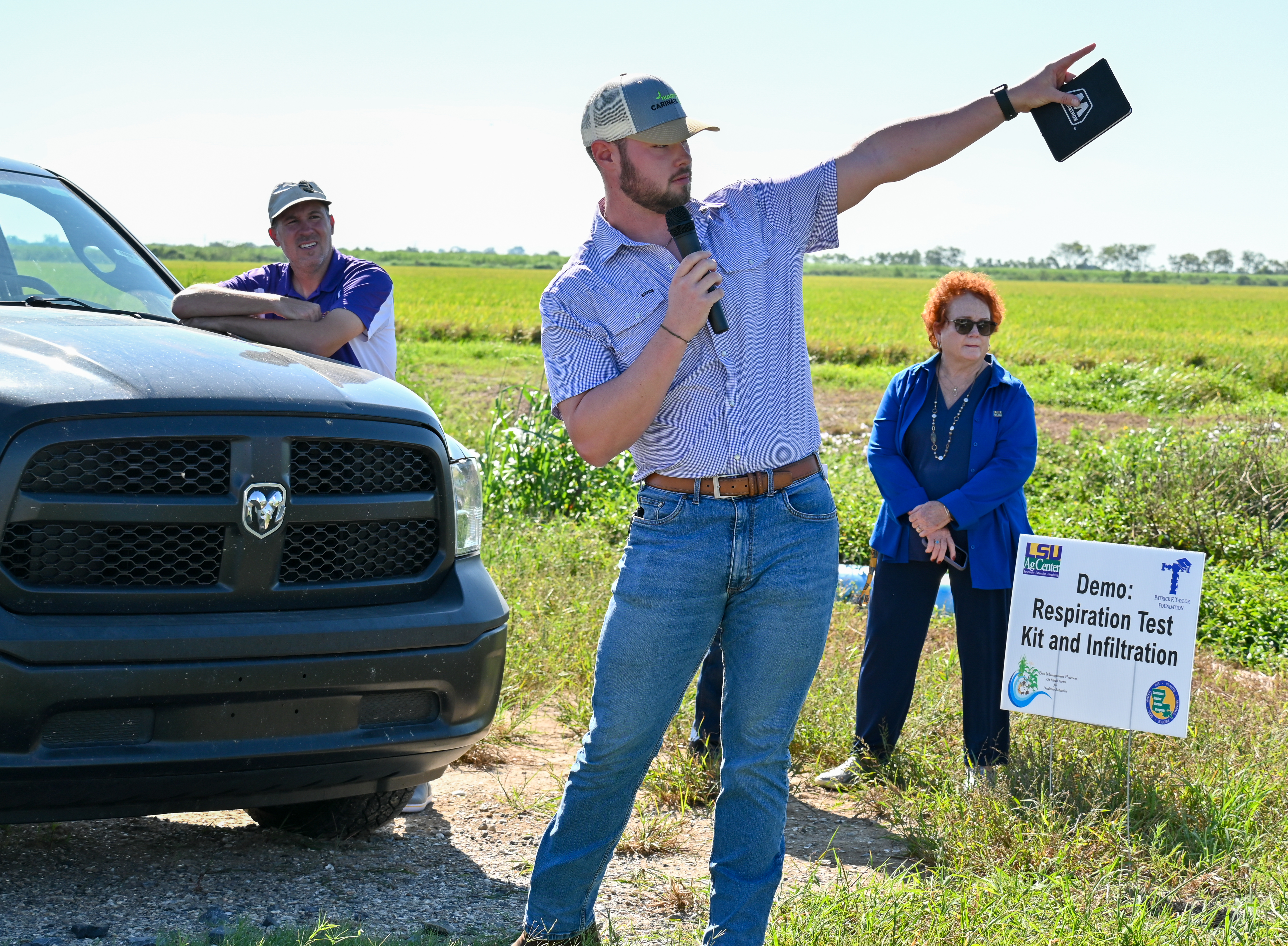 Man pointing at the field during presentation.