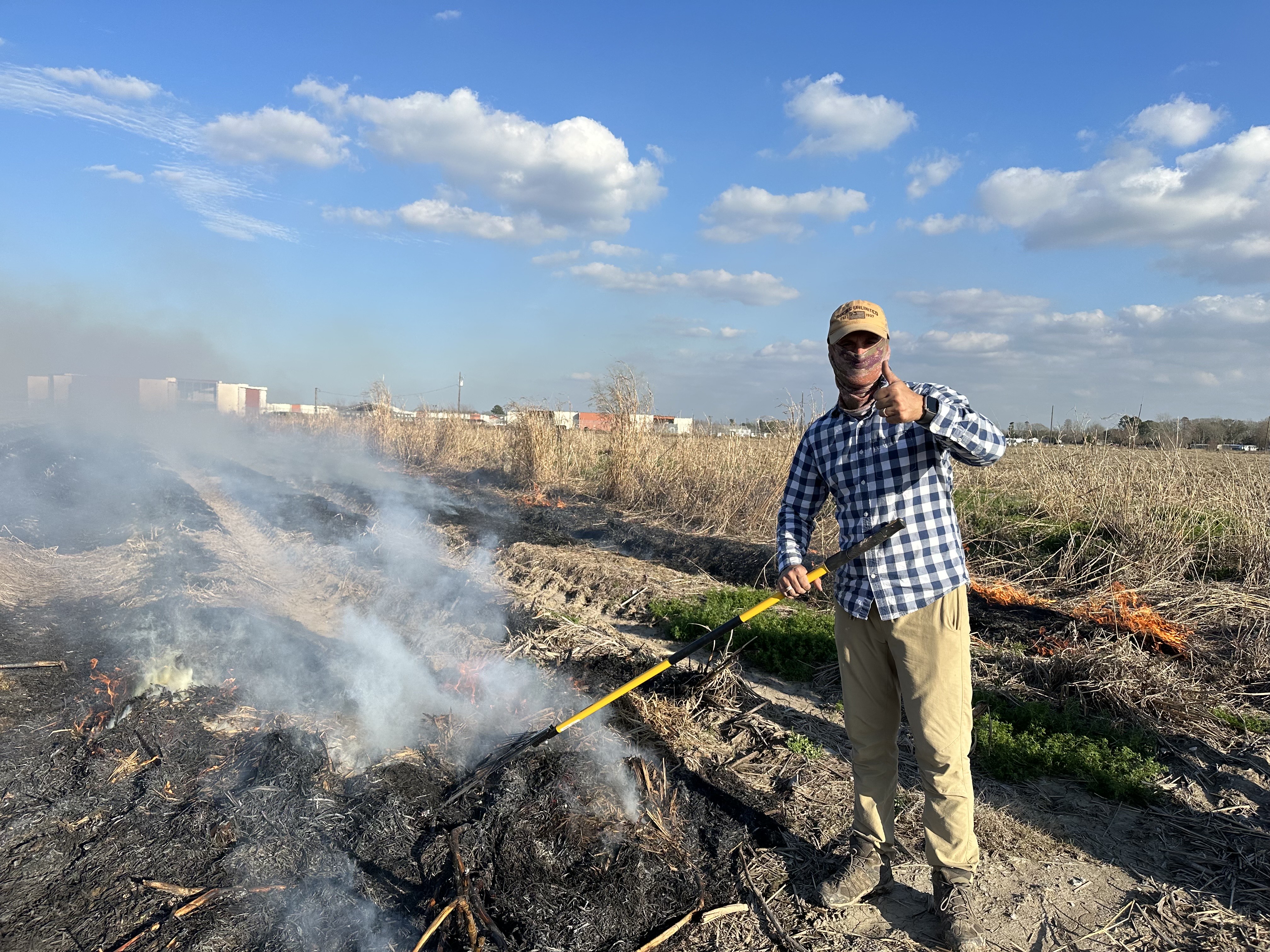 Man is burning a sugarcane field.