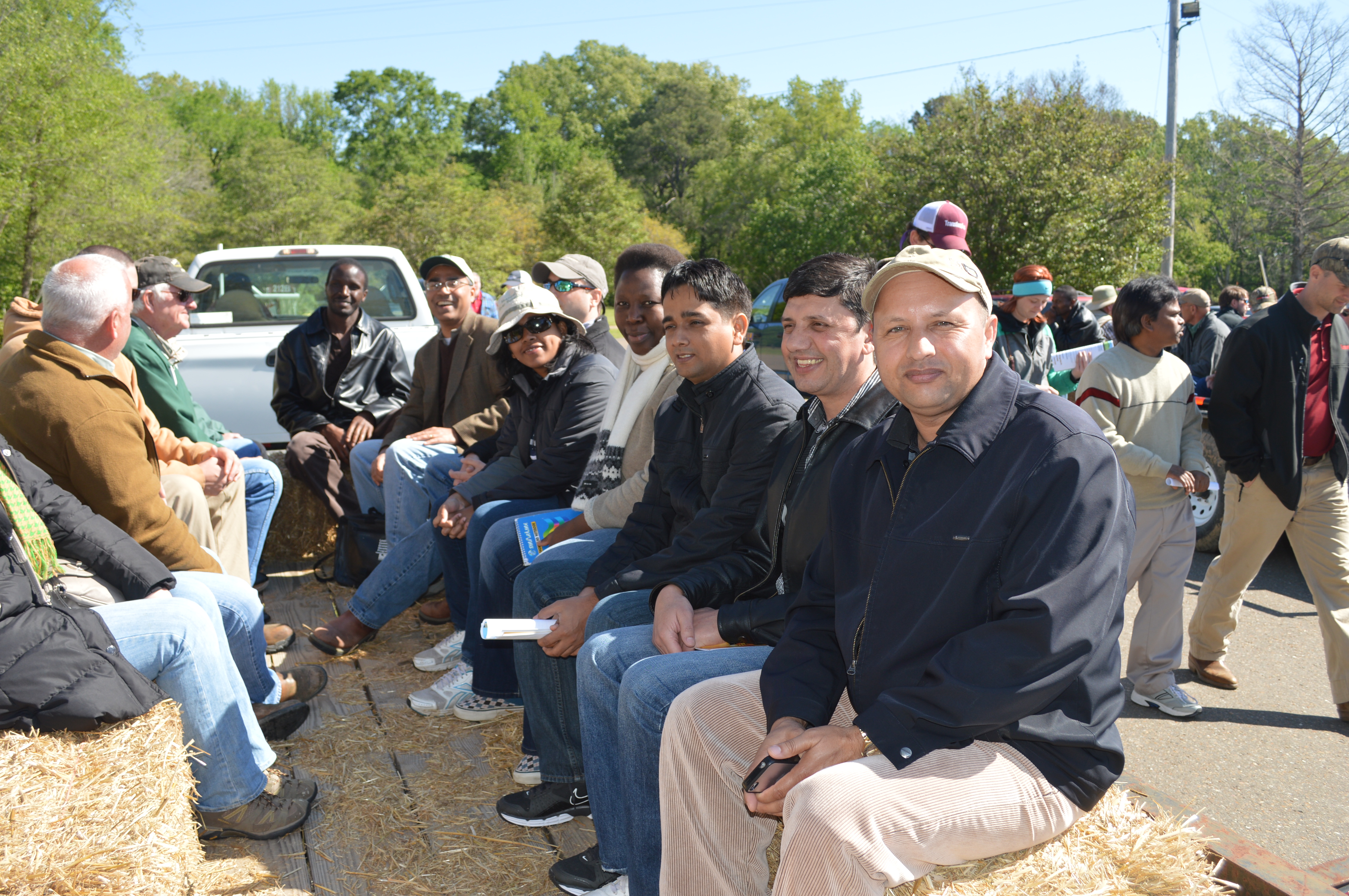 On trailers to ride to demonstration plots.