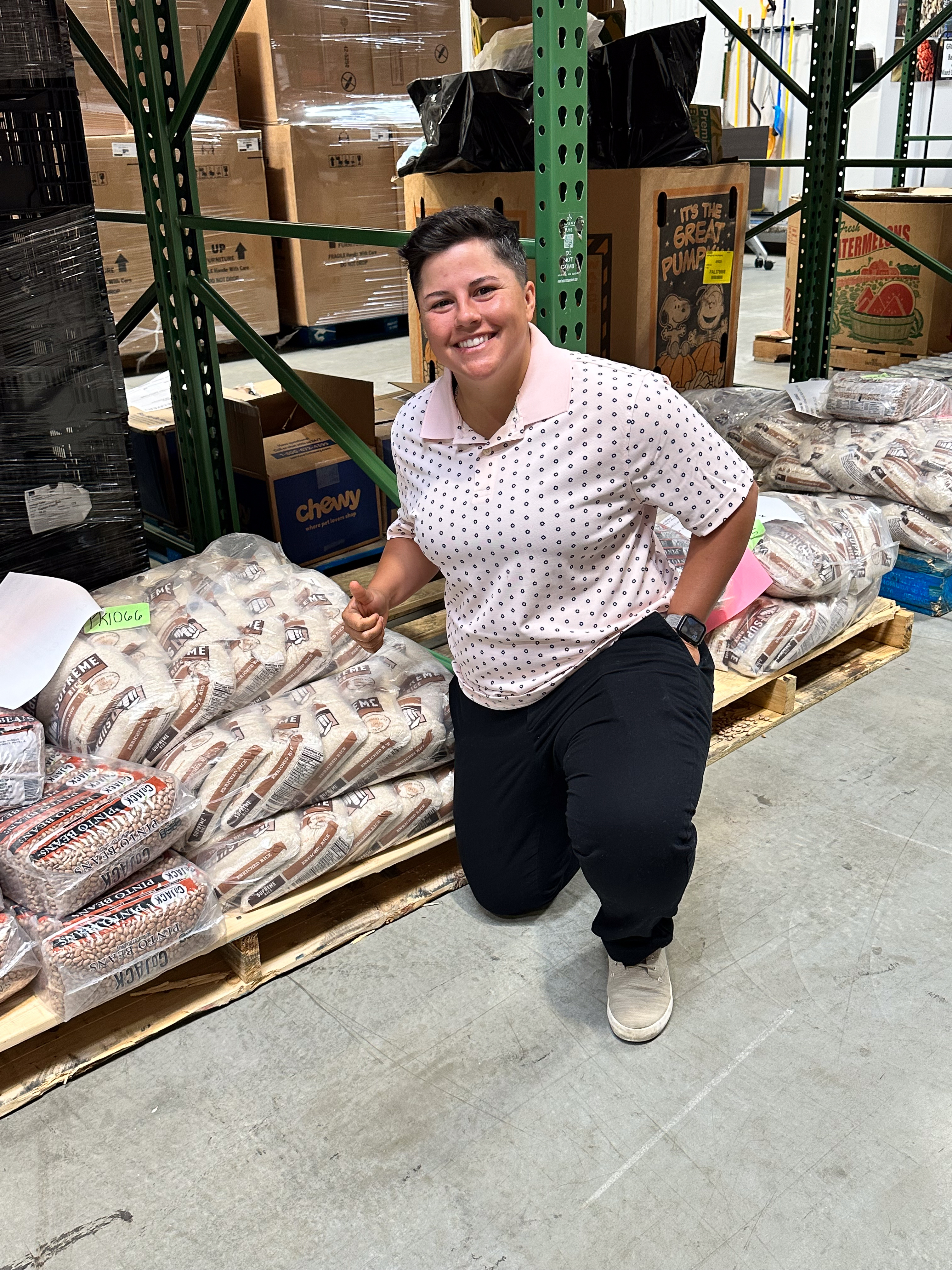 Laura Hebert next to Supreme rice at Healthy Harvest. 