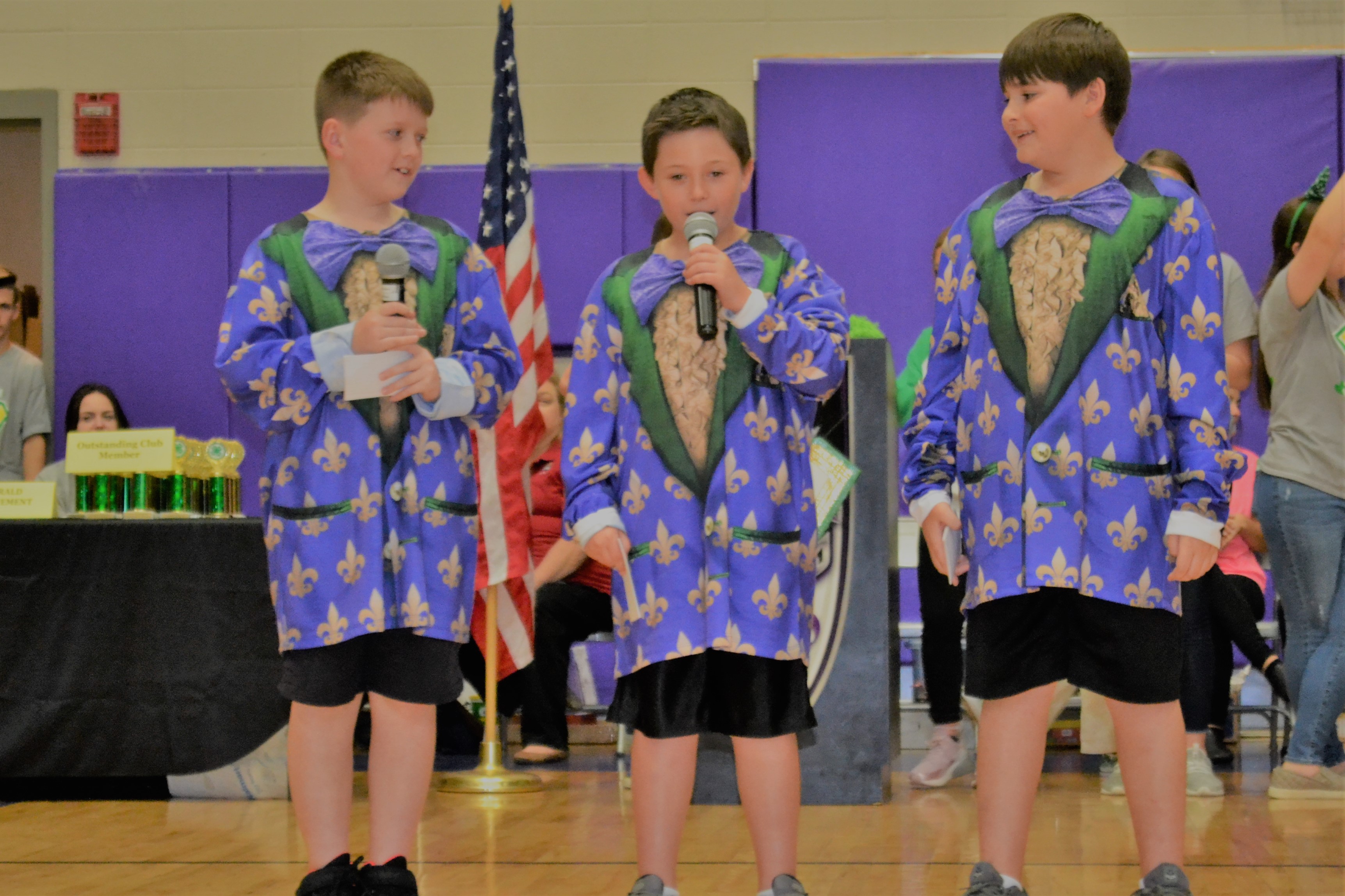 Three youth performing.