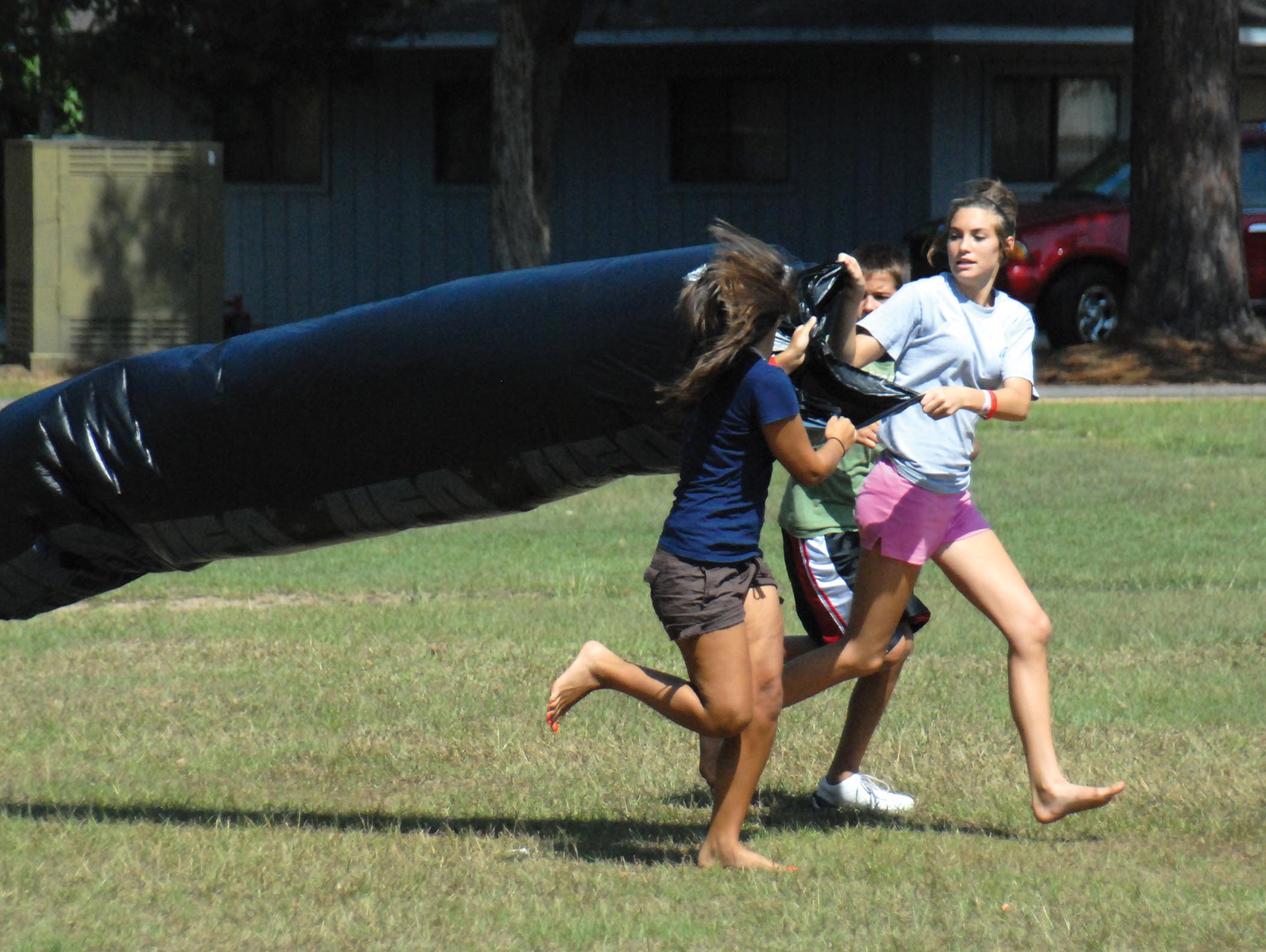 youth filling bag with air