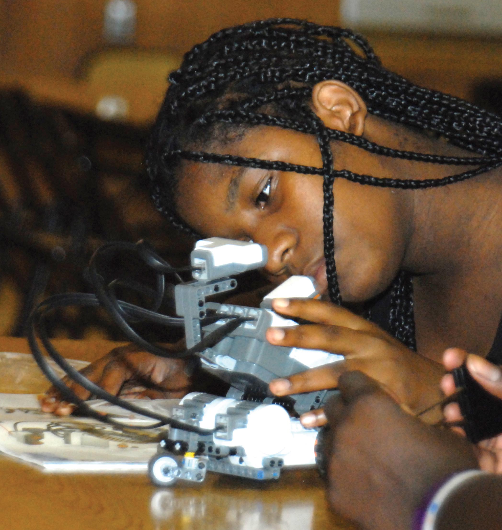 youth working on robot