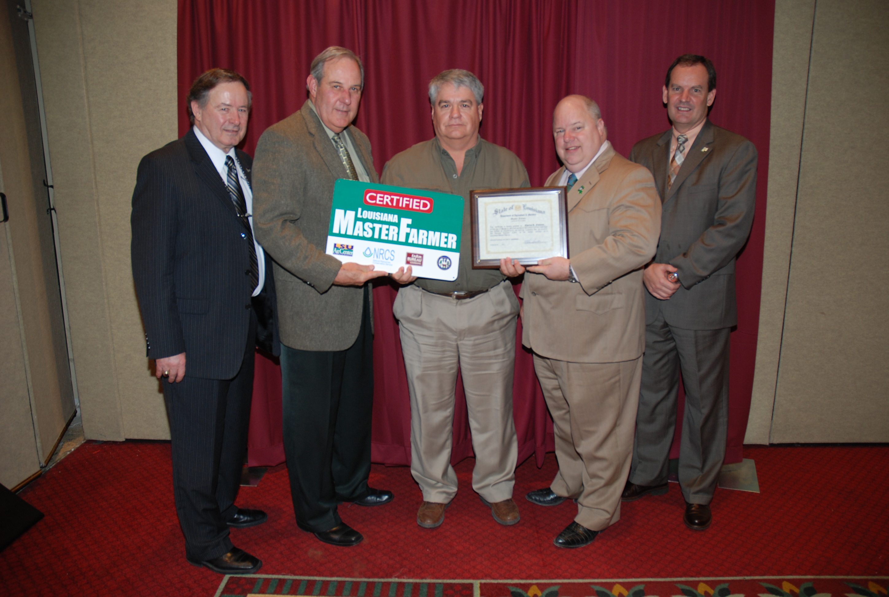 Charles Fontenot (center), of Lake Charles in Calcasieu Parish, 