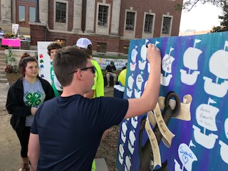 4-H Member Signing an Out of the Darkness Board