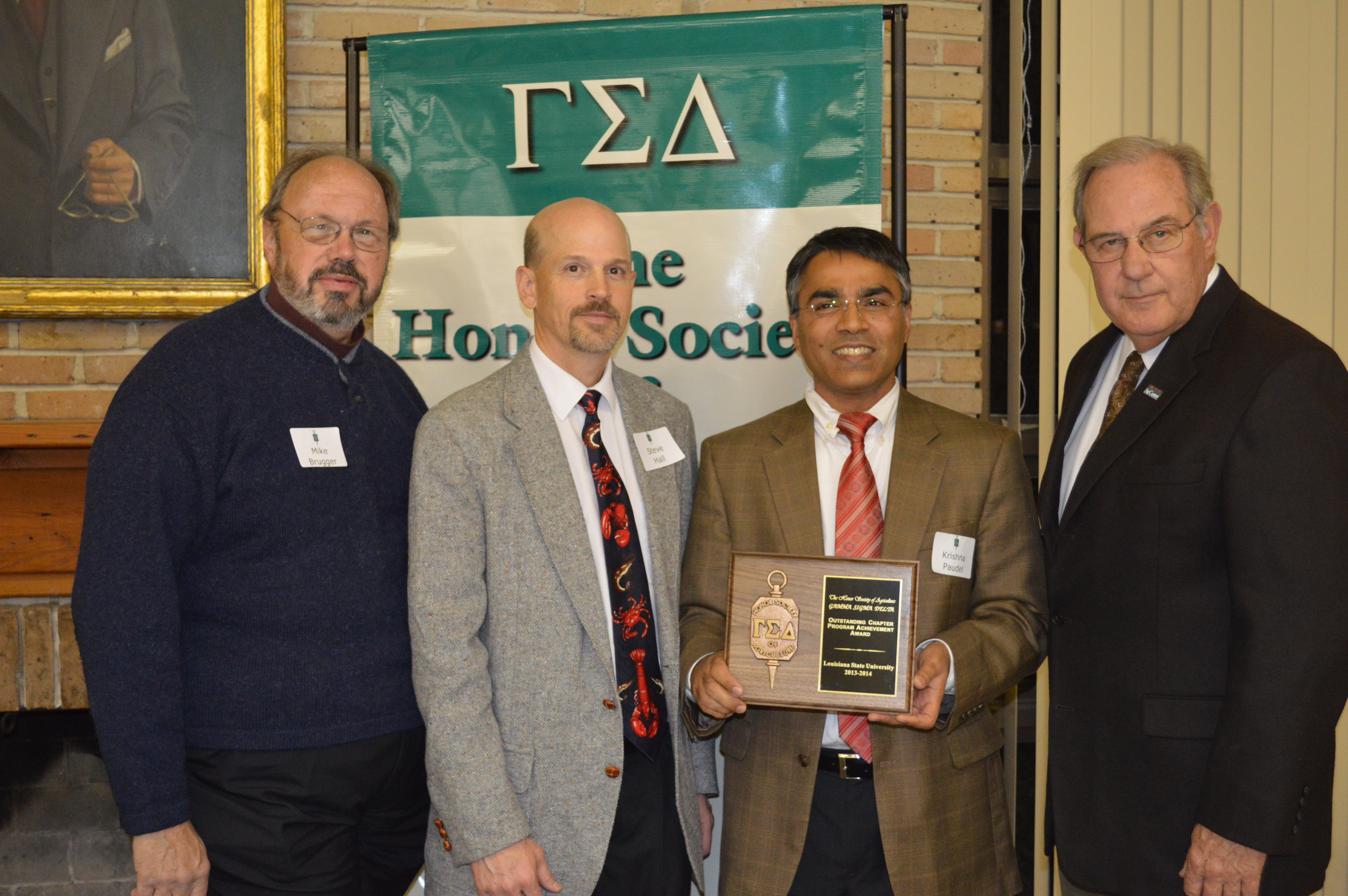 Brugger, Hall, Paudel and Richardson are seen with the Outstanding Chapter Award.