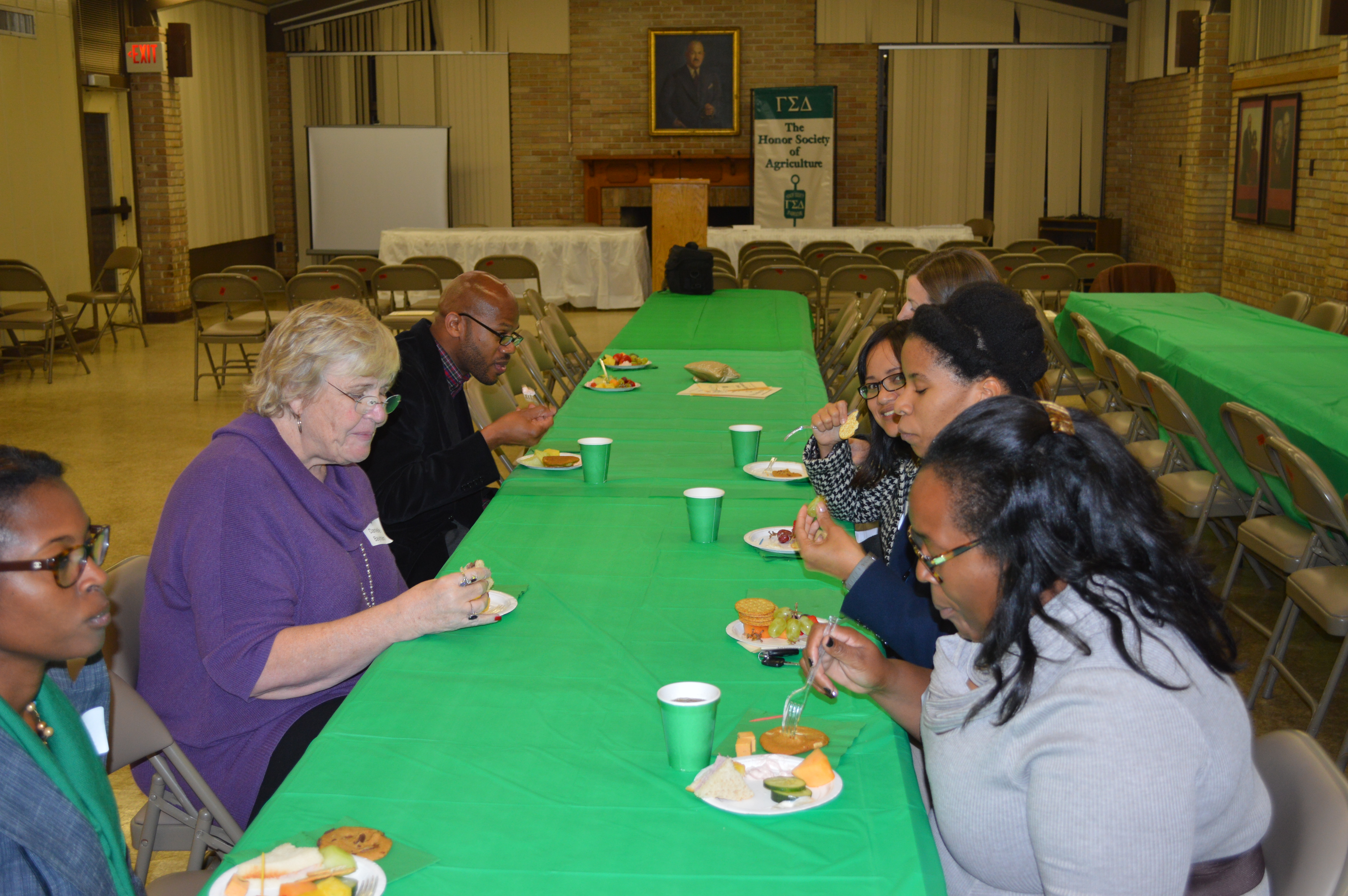 Members enjoy refreshments after the ceremony.
