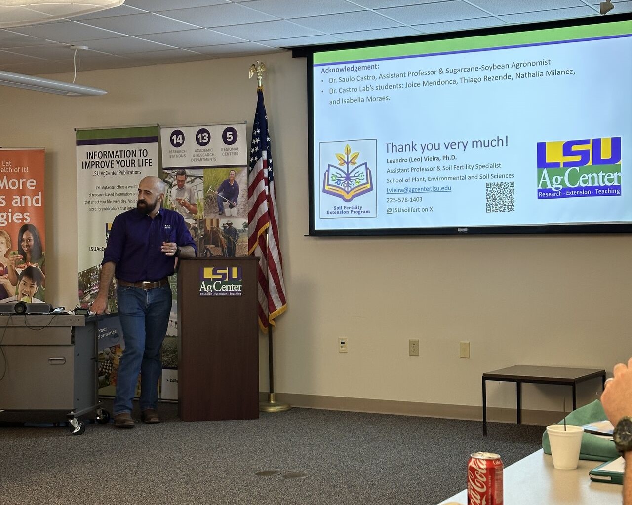 Man standing next to a podium.