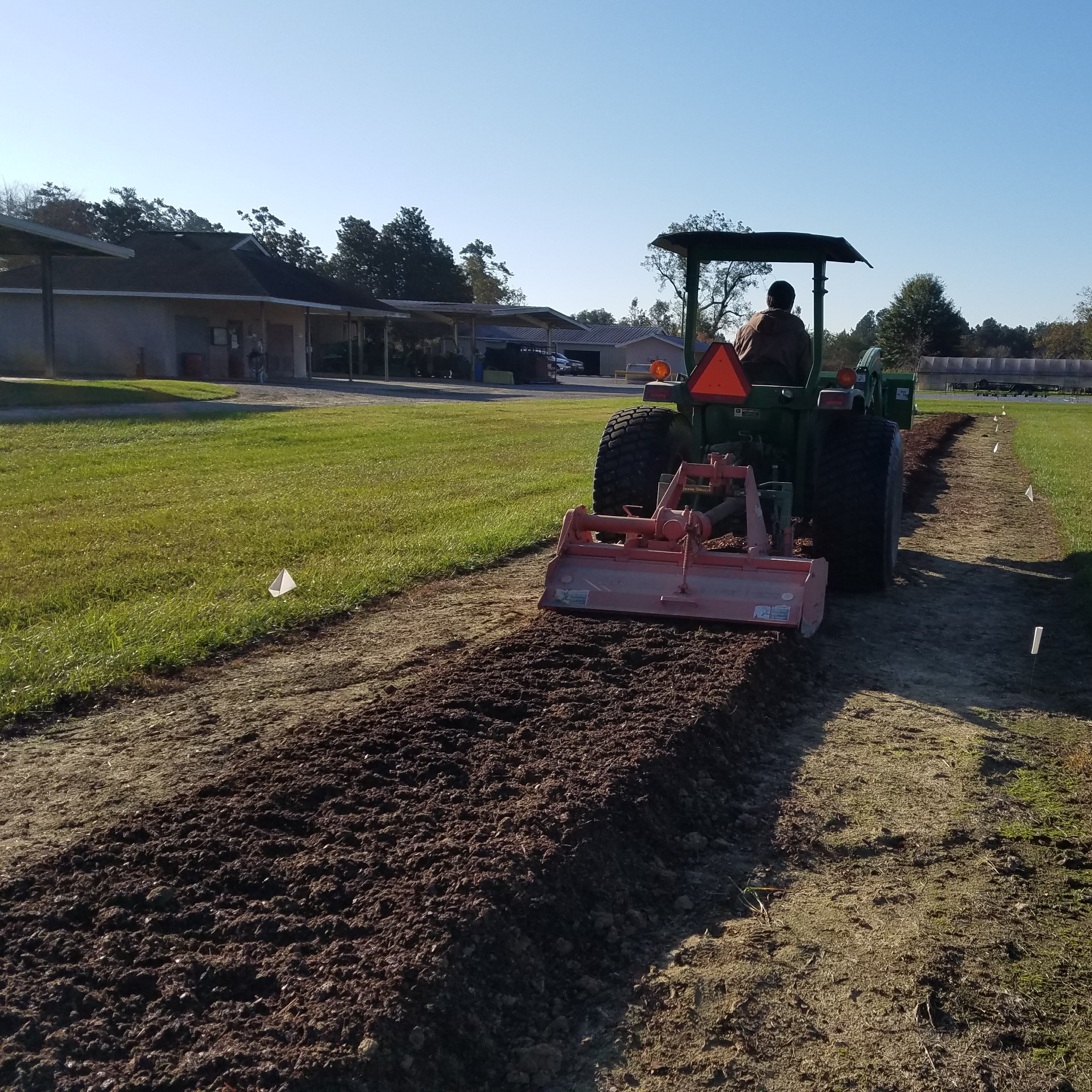 tractor and implement rototilling mulch into soil