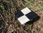 Survey tiles in field.
