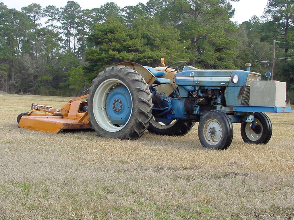 old farm tractor with mower