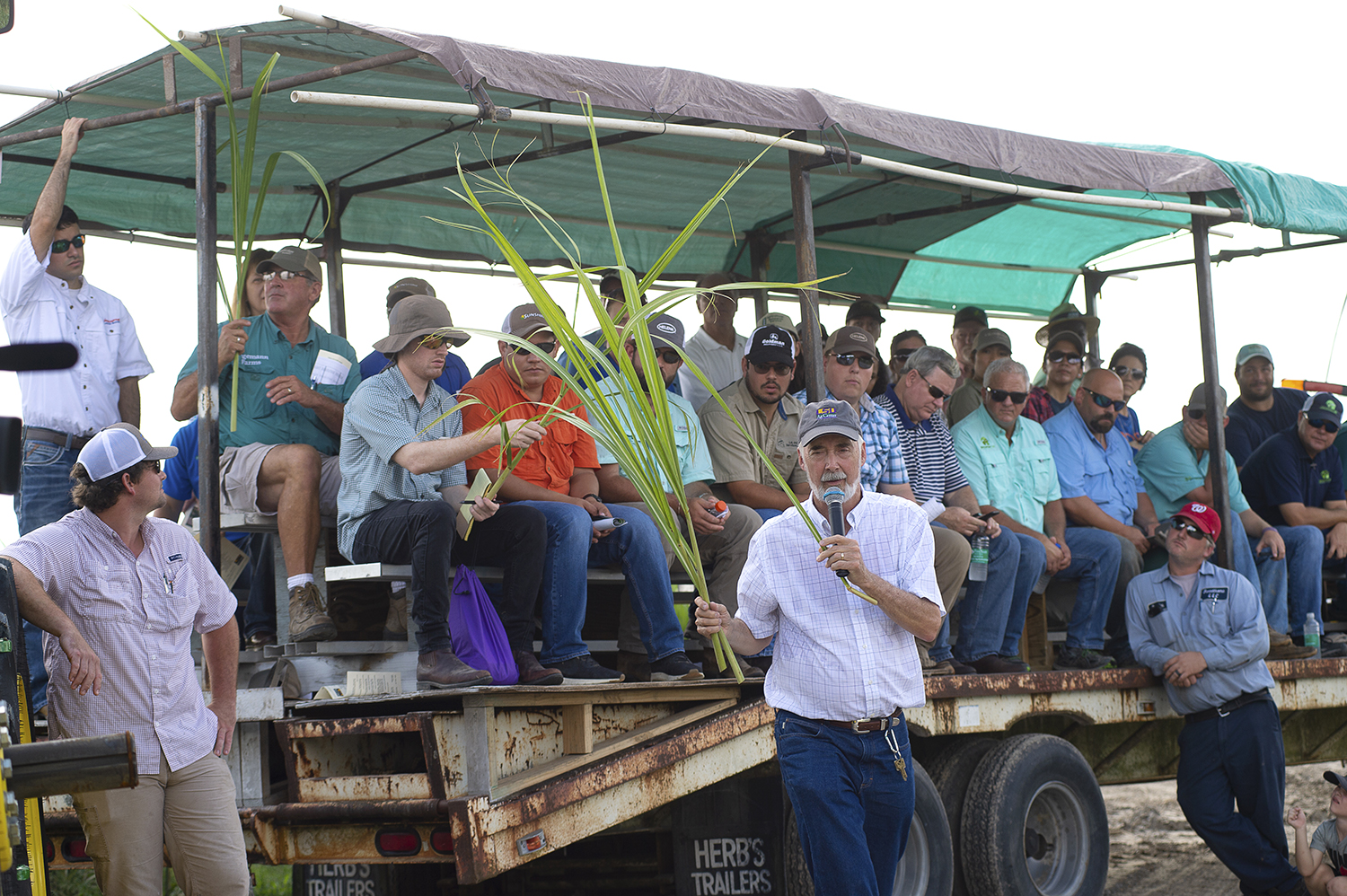 Jeff Hoy speaking to people at the field day event.