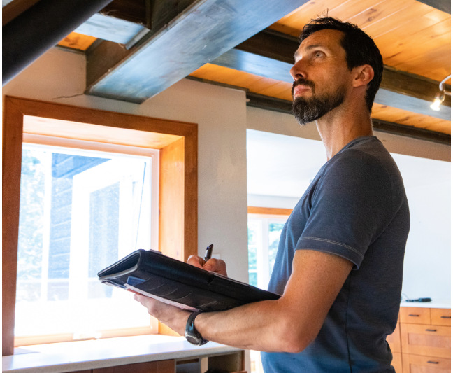 A man conducting a home audit.