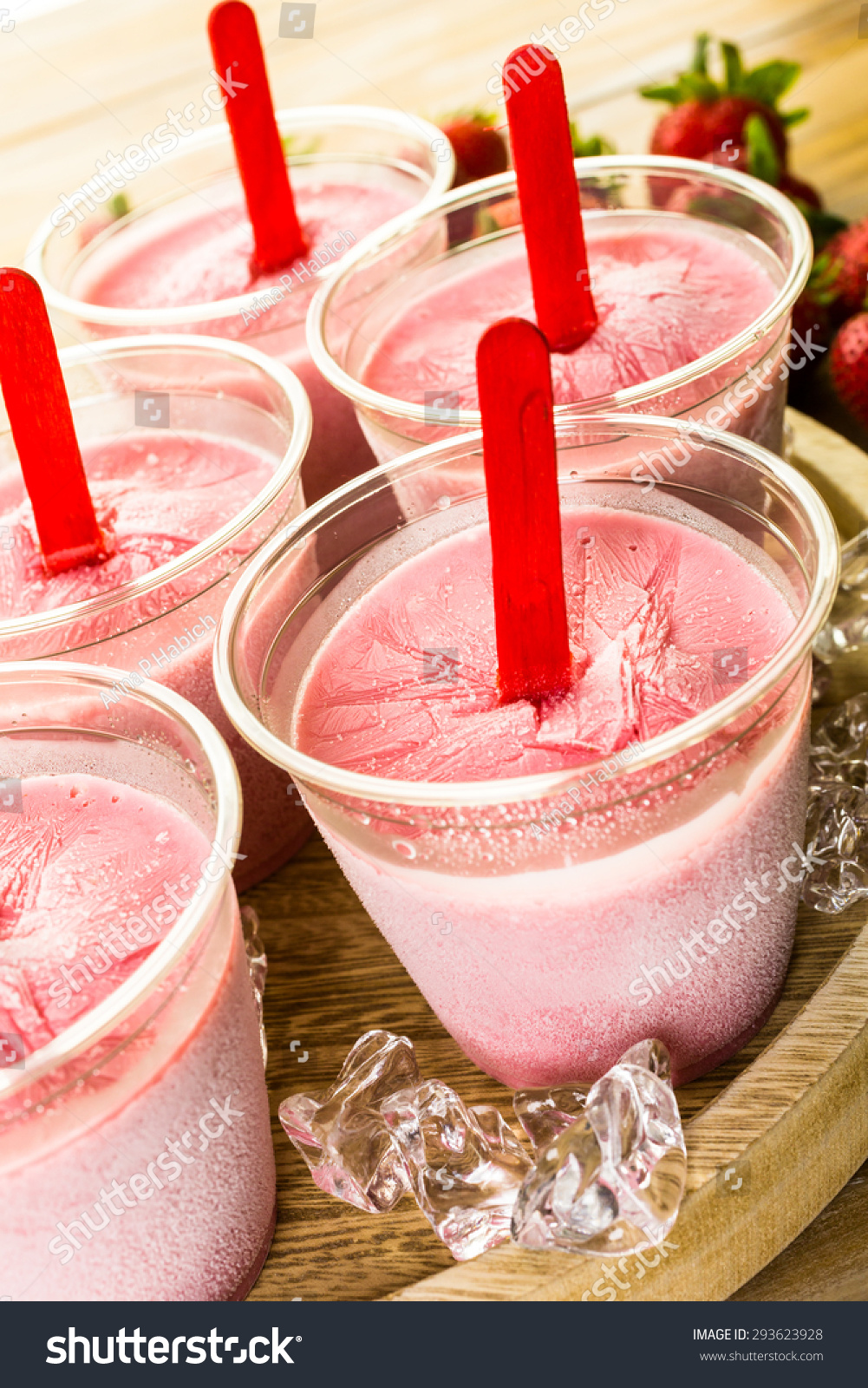stock-photo-homemade-strawberry-popsicles-made-in-plastic-cups-293623928jpg