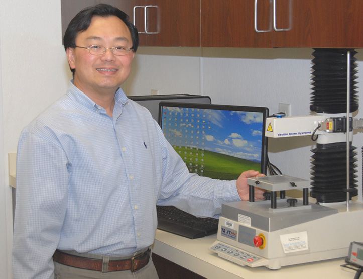 LSU AgCenter researcher Witoon Prinyawiwatkul explains a texture analyzer that’s used to measure