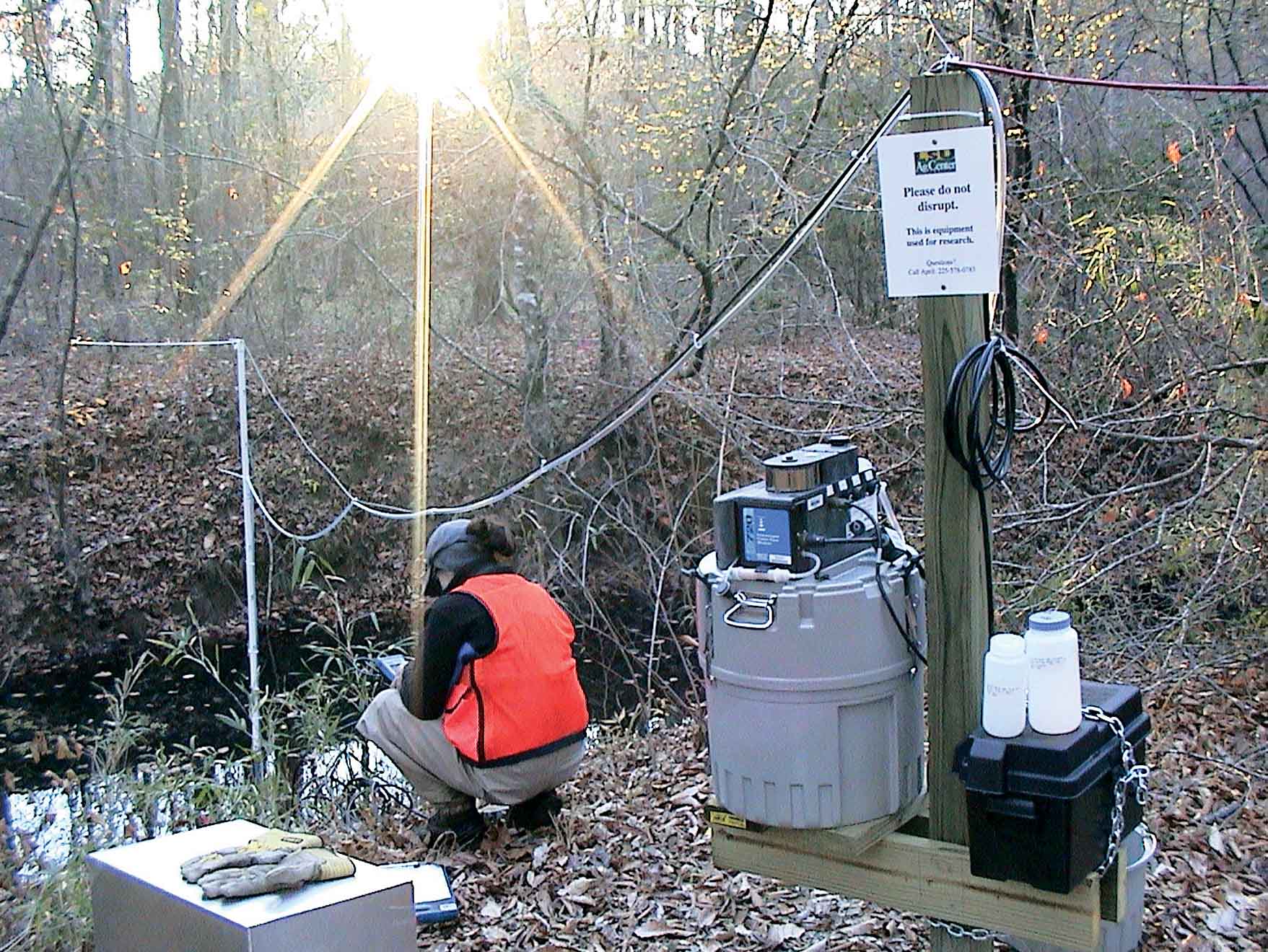 April Mason checks a sampler that analyzes the chemical content